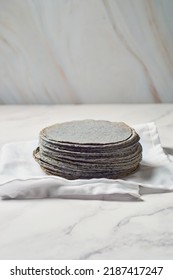 Stacked Mexican Blue Tortillas, Made With Blue Corn.