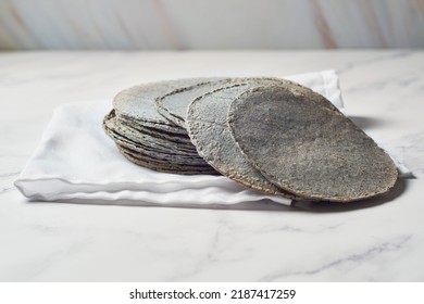 Stacked Mexican Blue Tortillas, Made With Blue Corn.