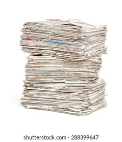 Stacked Newspaper Bundles On A White Background