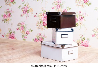 Stacked Office Storage Boxes On The Floor Of The Room