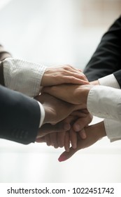 Stacked Pile Of Hands Close Up Vertical View, Motivated Multi-ethnic Business Team Join Together As Concept Of Engagement And Unity Promising Support In Collaboration, Help And Commitment In Teamwork