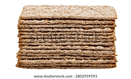 Stacked rectangular whole grain crispbread crackers with textured surface