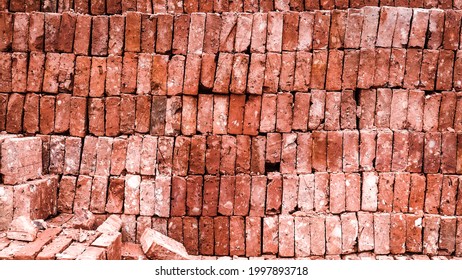 stacked red bricks ready to use