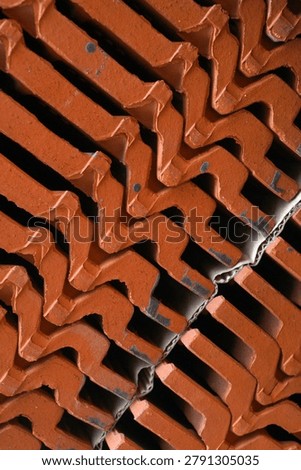 stacked red clay rooftiles for texture and background                                