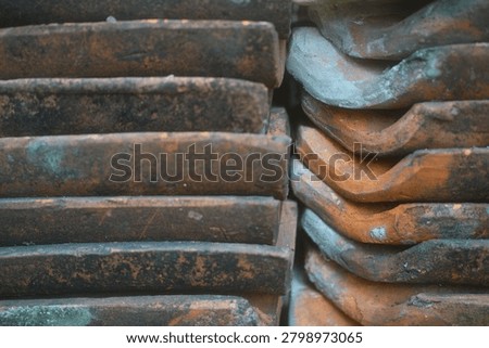 stacked red clay rooftiles for texture and background                                 