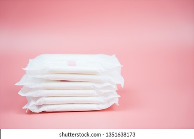 Stacked Sanitary Napkin Pad On Pink Background.