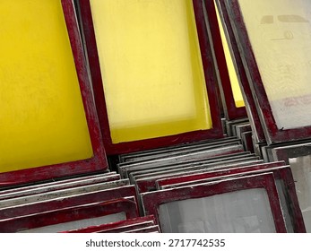 Stacked Screen Printing Frames with Red Edges – Tool Texture and Workshop Setup Study Shot