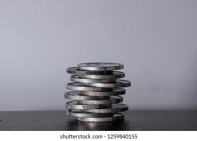 stacked silver coins - Shutterstock ID 1259840155