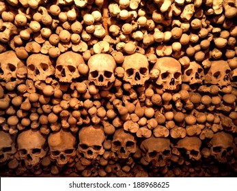 Stacked Skulls And Bones In Czech Church Cemetery.