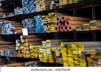 Stacked steels in metal warehouse - Shutterstock ID 1056706034