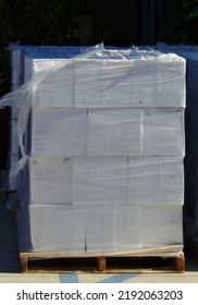 Stacked Wine Boxes In Plastic Wrap On A Pallet Ready For Shipping