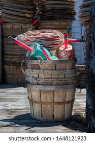 Stacked Wooden Bushel Baskets Holding Colorful Crab Floats To Mark The Underwater Location Of Crab Traps