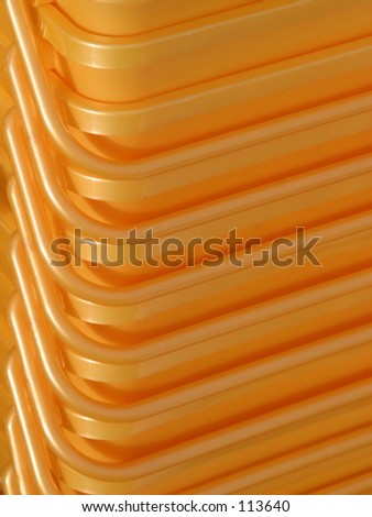Stacked yellow plastic containers