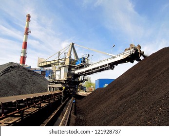 Stacker With A Heap Of Coal Next To The Plant