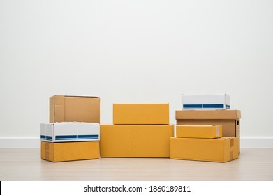 Stacking of box parcel cardboard mock up on blank space white background. - Shutterstock ID 1860189811