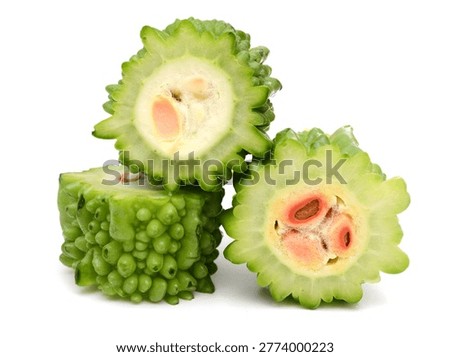 Stacking green bitter melon segments isolated on white