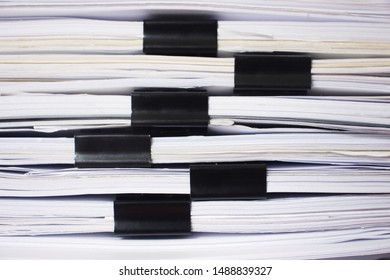 Stacking of office working document with paper clip folder.