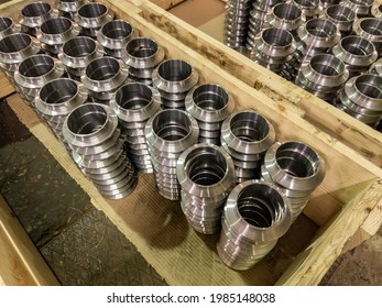 Stacks Of Batch Production Round Parts In A Wooden Boxes On Factory Floor