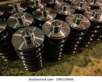 Stacks Of Batch Production Round Parts In A Wooden Box