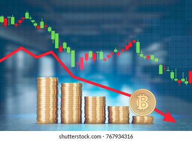 Stacks of bitcoins and a large coin standing on its side against a falling red graph a blurred office background. Mock up