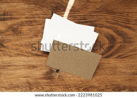 Stacks of businesscards with copy space on wooden background