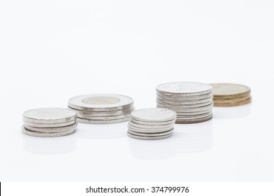 Stacks of Canadian Coins in a White Background.