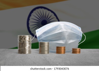 Stacks of coins in a decrease financial from COVID-19 crisis in India. - Powered by Shutterstock