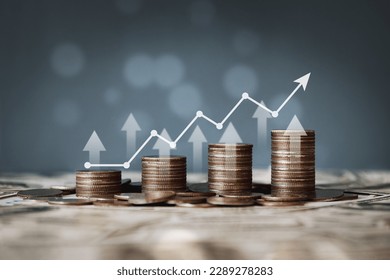 stacks of coins and graphs finance concept stock business investment