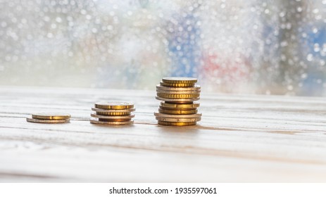 Stacks Of Coins On The Table. Small, Medium, Large Stack Of Money.