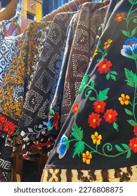Stacks of colourful embroidered kebayas