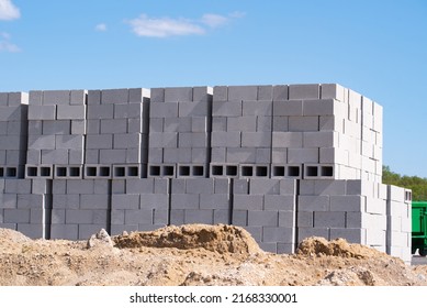 stacks of concrete blocks on pallets at a construction material wearhouse ready for sale concrete blocks are widely used in building construction site - Shutterstock ID 2168330001
