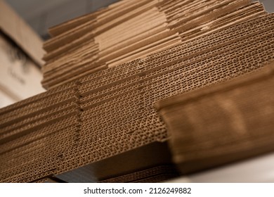 stacks of containerboard sheets in warehouse facility