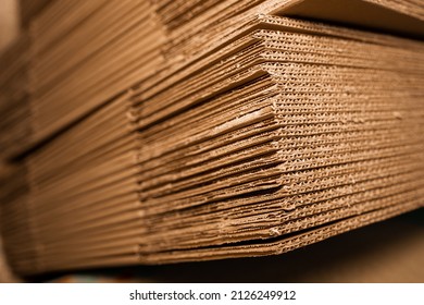 stacks of containerboard sheets in warehouse facility