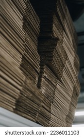 stacks of containerboard sheets in warehouse facility