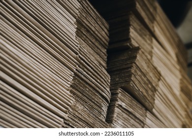 stacks of containerboard sheets in warehouse facility