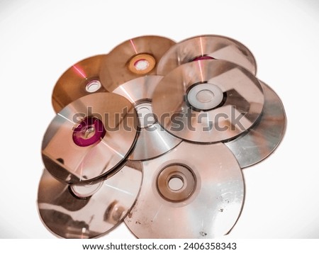 stacks of damaged DVDs and CDs
