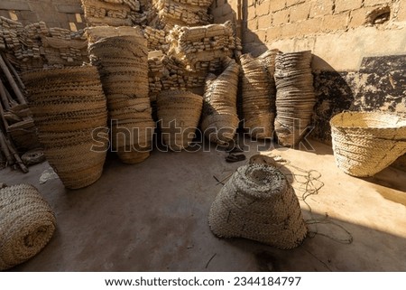 Stacks of date palm leaf baskets, handmade baskets