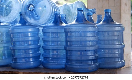 Stacks of empty plastic bottle or gallon of purified drinking water to refill