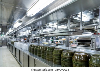 Stacks Of Empty Serving Dishes In Commercial Kitchen