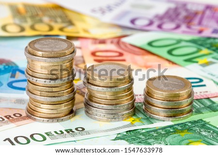 Stacks of euro coins as symbol for decreasing taxes 