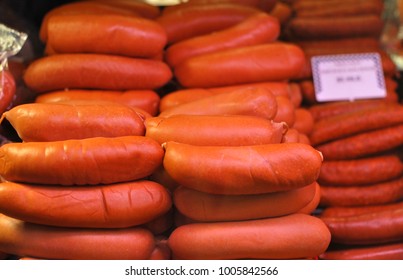 Stacks Of Fat Link Sausages In A Deli Case, Close Up