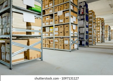 Stacks Of Files And Paperwork Placed In Bookshelves With Folders And Documents In Cardboard Box Archive, Storage Room.