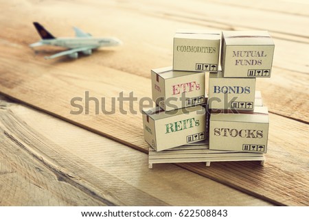 Stacks of financial investment products on wood pallet. Ideas for assembling a portfolio of assets which expected return is maximized for a given level of risk, defined as variance. Financial concept.