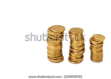 Stacks of gold colored coins, euro cents isolated on white with clipping path