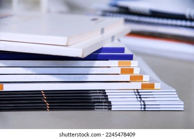 Stacks of magazines on the table in the office