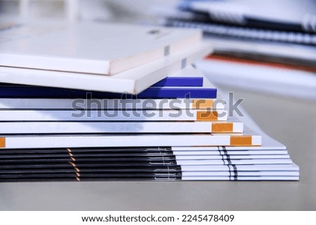 Stacks of magazines on the table in the office