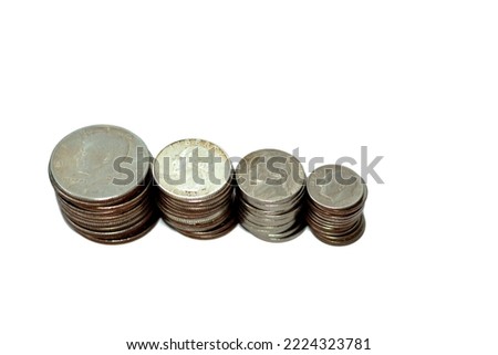 stacks of old American coins of half a dollar John F. Kennedy fifty 50 cents, George Washington quarters 25 twenty five cents, Franklin D. Roosevelt dime 10 cents and Thomas Jefferson 5 cents