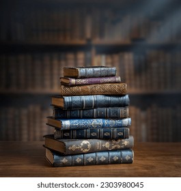 Stacks of old books on wooden desk in old library. Ancient books historical background. Retro style. Conceptual background on history, education, literature topics. - Powered by Shutterstock