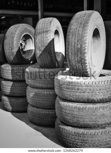 stacks of old used tires for sale at store.\
second hand car tires.stack of old\
tires.