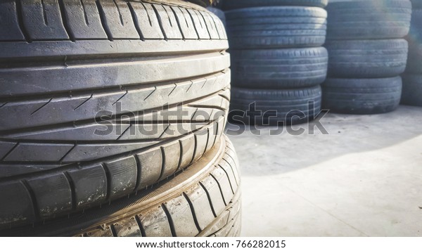 stacks of old used tires for sale at store.\
Second hand car tires.stack of old\
tires.